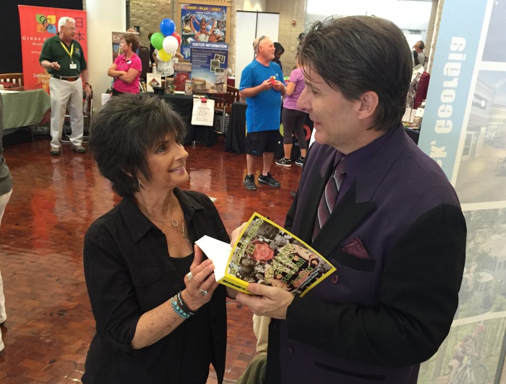 Randall Franks signs his latest book â€œEncouragers III: A Guiding Handâ€ for Glenda Jones at the I-75 Visitors Information Center in Ringgold, Ga. (Photo: Randall Franks Media/Bill Jones)